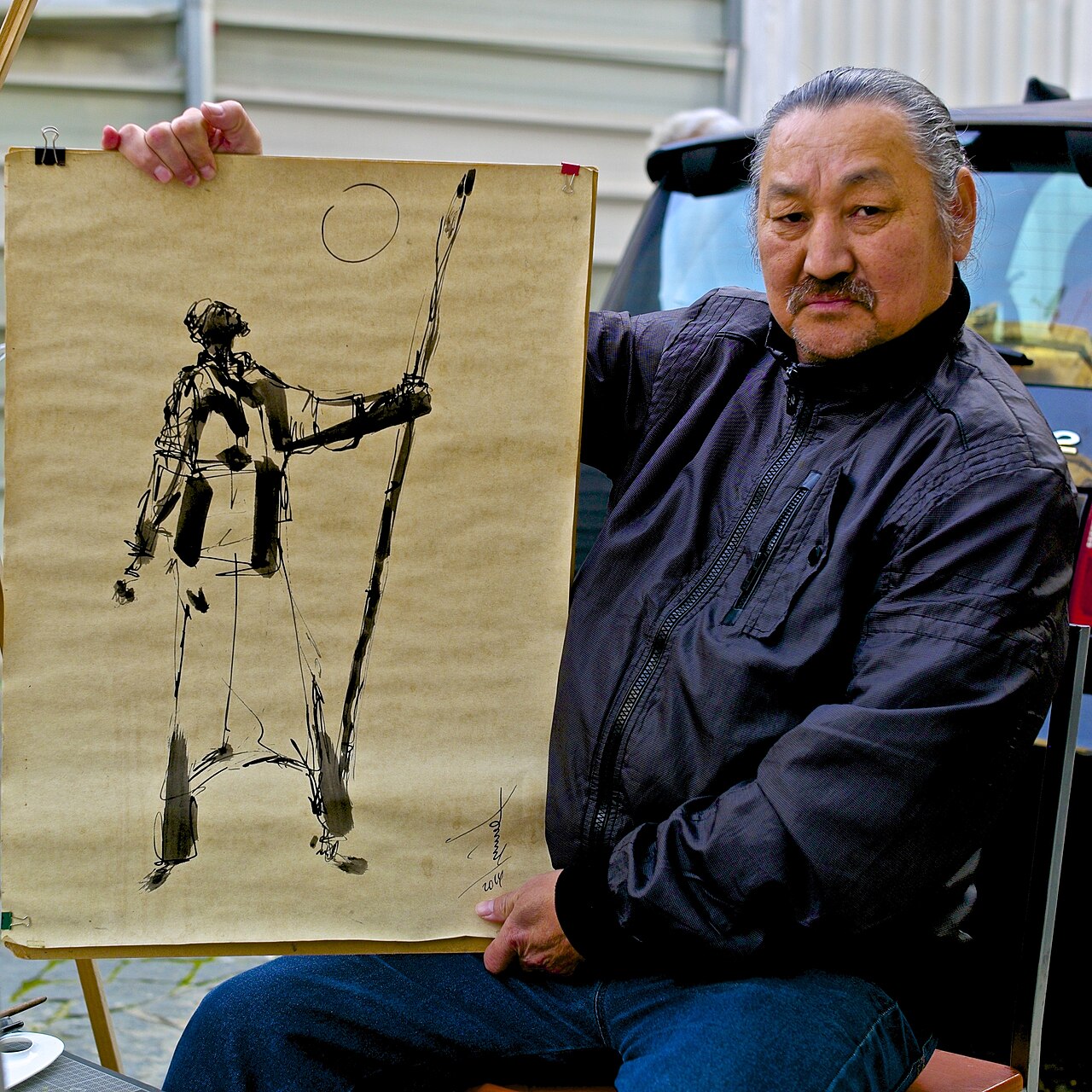 Rouslam Botiev with a black ink drawing