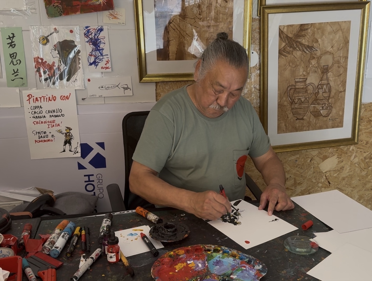Rouslam Botiev working at his atelier table in Alfama